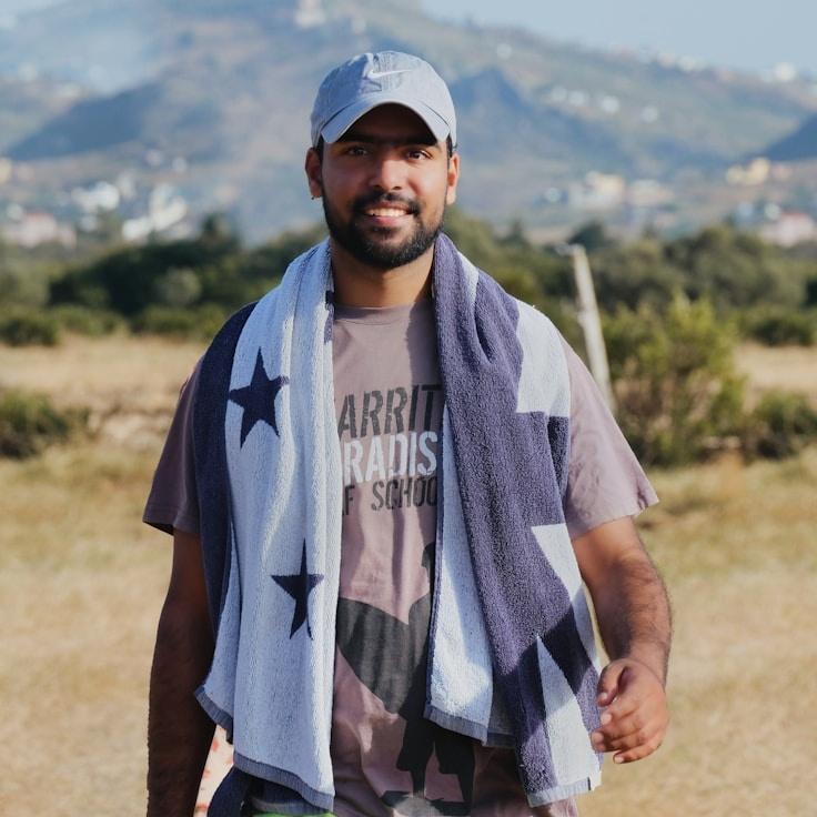 Alex Carter, Lead Design Curator at Scalable Operations Platform, reviewing corporate floral arrangements